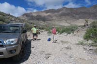 05-end_of_the_road,Joel_and_Laszlo_ready_to_begin_hike_via_route_to_peak_in_background