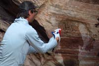 06-spraying_solvent_to_break_down_the_paint