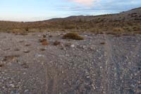 77-crossing_final_wash_with_trailhead_ahead,only_my_vehicle_in_parking_lot_at_sunset