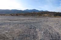 01-Twilight_Zone_parking_lot_view_to_across_Kyle_Canyon_Rd_towards_Burro_Rd
