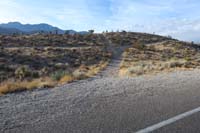 02-Burro_Rd_is_right_and_left-checking_out_path_over_the_hump