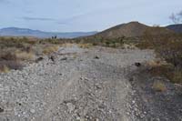 06-after_traveling_.8_miles,Burro_Road_makes_a_sharp_turn_to_the_right-blocked_parking_lot_ahead