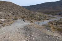 11-steep_dirt_road_with_blockage_discouraging_vehicle_use