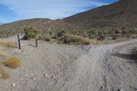 16-Burro_Rd_continues,another_barrier_with_Red_Rock_NCA_sign_discouraging_vehicle_use