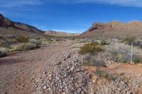 10-pretty_scenery_up_wash,trail_markers_are_at_side_of_wash_even_though_wash_is_trail