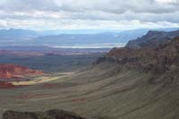 21-scenic_view_looking_E-zoom_view_of_Lake_Mead_in_distance_and_sloped_thrust_fault_erosion
