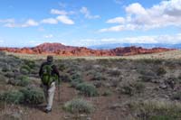 52-Laszlo_walking_towards_very_clear_and_vibrant_Valley_of_Fire,fee_station_just_to_the_left