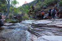 031-group_walking_along_the_rocks_by_the_scenic_stream