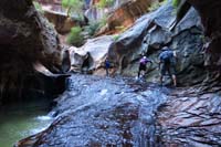 083-group_traversing_the_slick_rock_to_the_top_of_The_Subway
