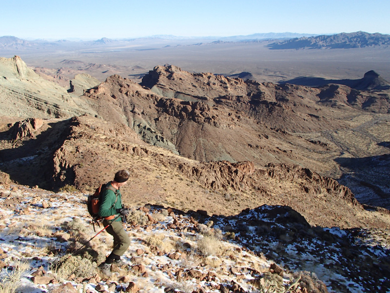 19-Tracy_scrambling_down_neat_terrain-Boulder_City_in_far_distance