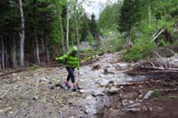 50-trail_is_a_stream-Mommy_balancing_on_the_rocks_avoiding_the_water