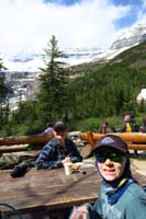 048-enjoying_a_snack_and_items_purchased_from_the_side_tent