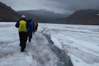 095-group_hiking_back_along_frozen_stream_on_surface